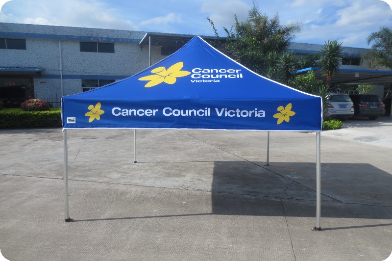 blue and yellow custom marquee with the words cancer council victoria on it