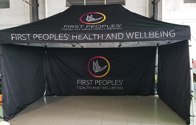 black custom marquee with the first peoples health and well being logo on it