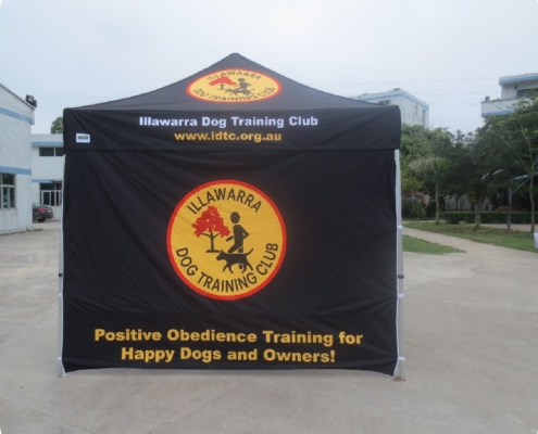 black custom marquee with a yellow and red logo on it