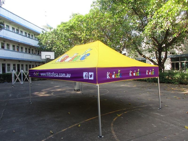 yellow and purple custom marquee sitting on top of a basketball court