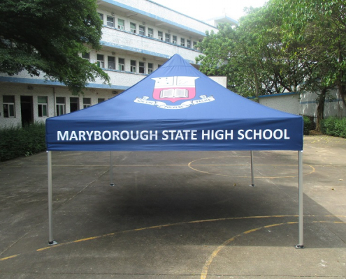 blue custom marquee with the marlborough state high school logo on it