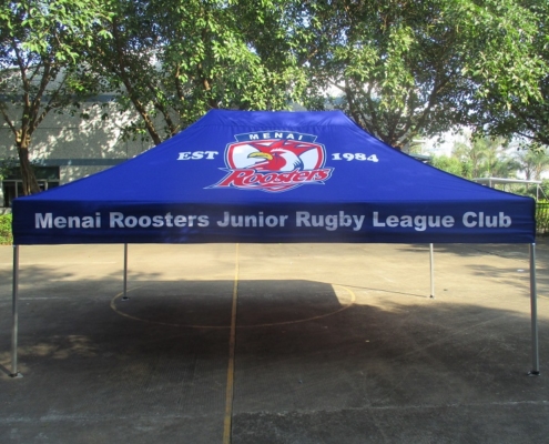 blue custom marquee with the name of the menai rosters junior rugby league club