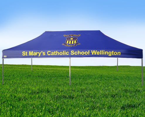 blue custom marquee with the words st mary's catholic school wellington on it