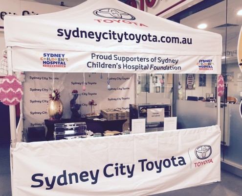 white custom marquee with a sign for sydney city toyota