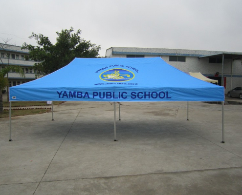 blue custom marquee with the yamba public school logo on it